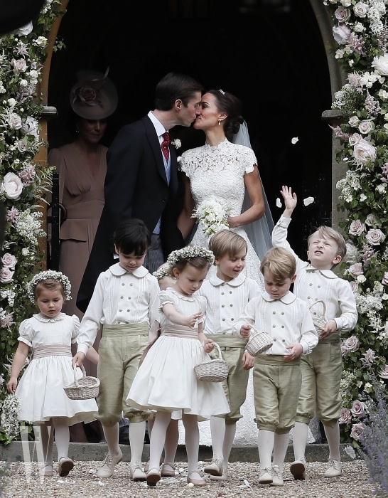 ENGLEFIELD, ENGLAND - MAY 20: Pippa Middleton and James Matthews kiss after their wedding at St Mark's Church on May 20, 2017 in Englefield, England.Middleton, the sister of Catherine, Duchess of Cambridge married hedge fund manager James Matthews in a ceremony Saturday where her niece and nephew Prince George and Princess Charlotte was in the wedding party, along with sister Kate and princes Harry and William. (Photo by Kirsty Wigglesworth - Pool/Getty Images)
