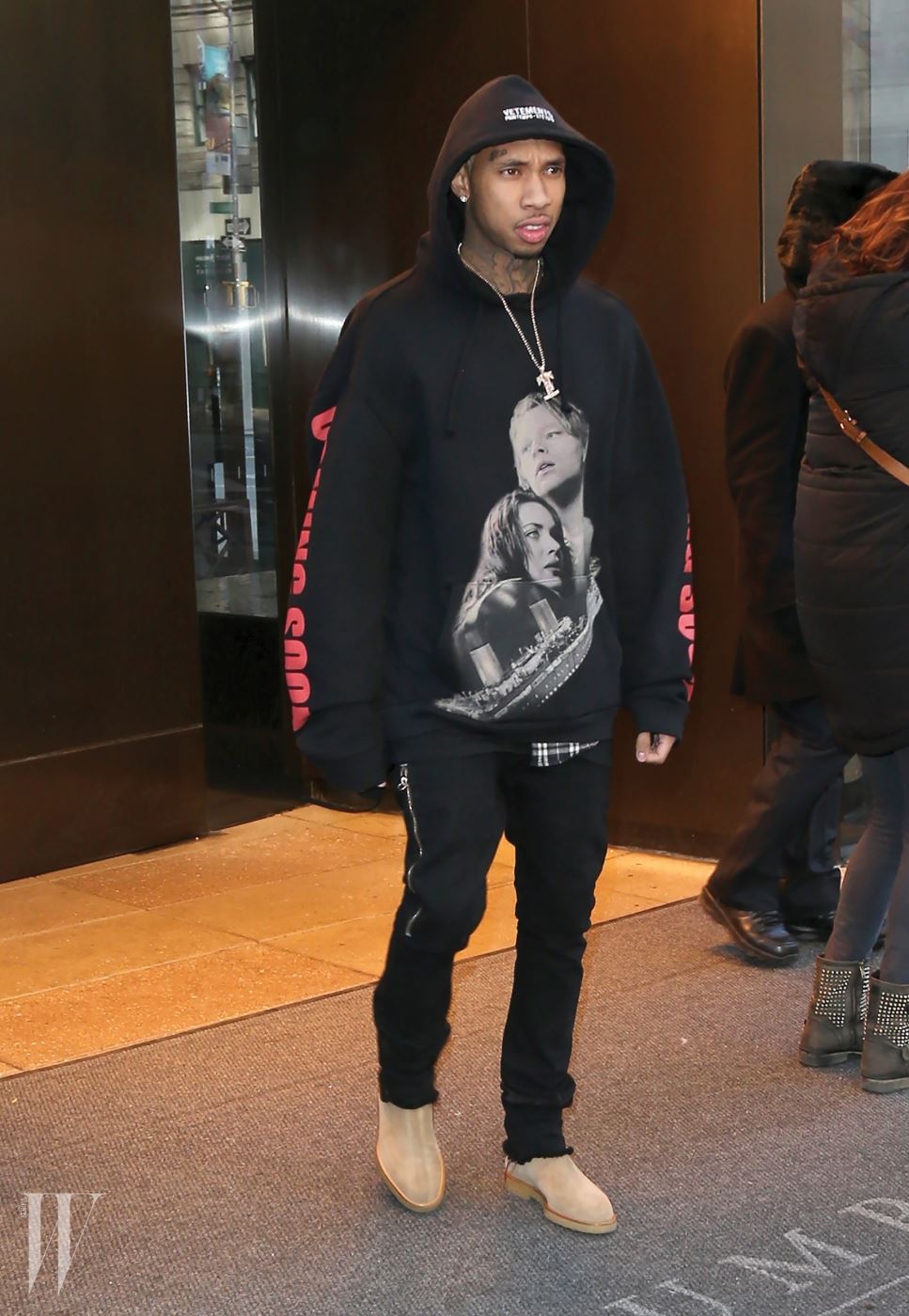 Tyga steps out in New York City wearing a black hoodie with an image of Jack and Rose from 'Titanic'. Pictured: Tyga Ref: SPL1226854  130216   Picture by: Splash News Splash News and Pictures Los Angeles:310-821-2666 New York:	212-619-2666 London:	870-934-2666 photodesk@splashnews.com 