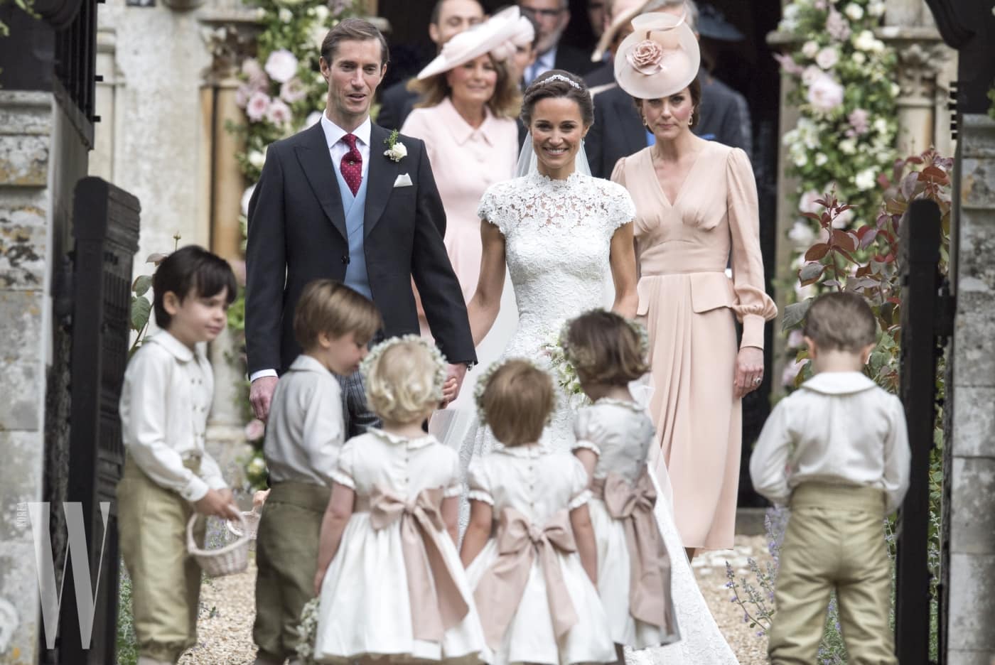 ENGLEFIELD GREEN, ENGLAND - MAY 20: Pippa Middleton and James Matthews smile as they are joined by Catherine, Duchess of Cambridge, right, after their wedding at St Mark's Church onMay 20, 2017 in Englefield, England(Photo by Arthur Edwards - WPA Pool/Getty Images)