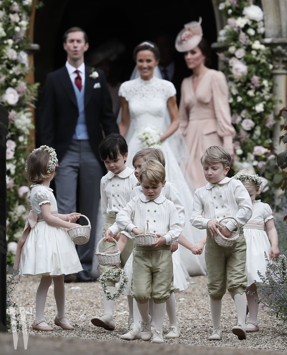 ENGLEFIELD, ENGLAND - MAY 20:  Prince George, center, stands with other flower boys and girls after the wedding of Pippa Middleton and James Matthews at St Mark's Church on May 20, 2017 in Englefield, England.Middleton, the sister of Catherine, Duchess of Cambridge married hedge fund manager James Matthews in a ceremony Saturday where her niece and nephew Prince George and Princess Charlotte was in the wedding party, along with sister Kate and princes Harry and William. (Photo by Kirsty Wigglesworth - Pool/Getty Images)