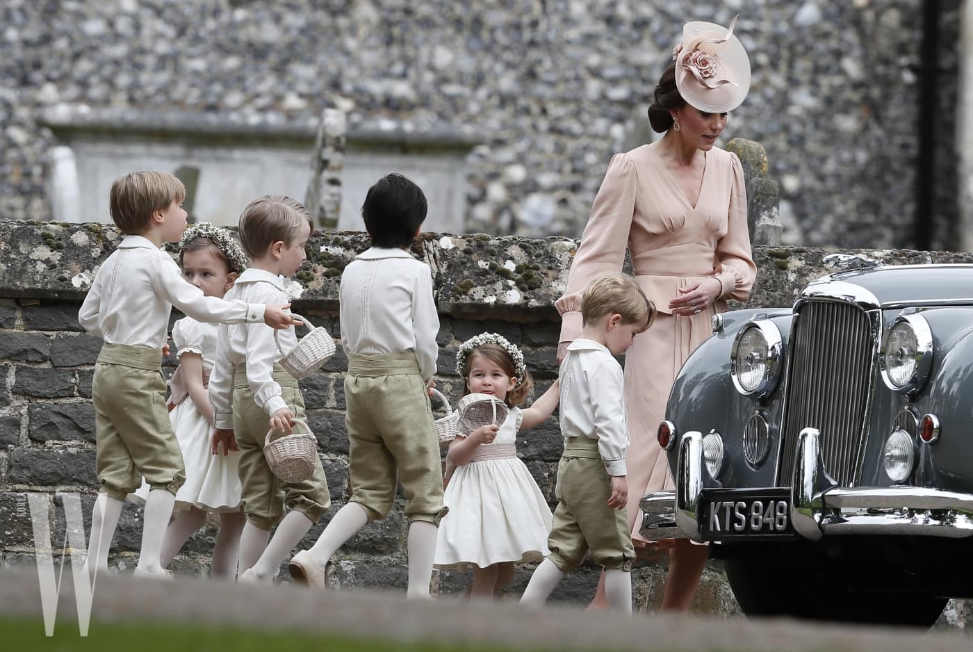 ENGLEFIELD, ENGLAND - MAY 20:  Catherine, Duchess of Cambridge, right, walks with the flower boys and girls, including Prince George, second right, and Princess Charlotte after the wedding of Pippa Middleton and James Matthews at St Mark's Church ion May 20, 2017 in in Englefield, England.  Middleton, the sister of Catherine, Duchess of Cambridge married hedge fund manager James Matthews in a ceremony Saturday where her niece and nephew Prince George and Princess Charlotte was in the wedding party, along with sister Kate and princes Harry and William. (Photo by Kirsty Wigglesworth - Pool/Getty Images)