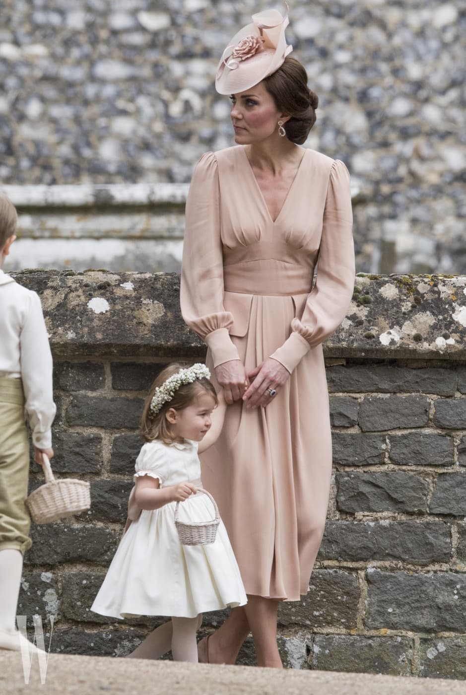ENGLEFIELD GREEN, ENGLAND - MAY 20: Catherine, Duchess of Cambridge speaks to Princess Charlotte after the wedding of Pippa Middleton and James Matthews at St Mark's Church on May 20, 2017 in in Englefield, England. (Photo by Arthur Edwards - WPA Pool/Getty Images)