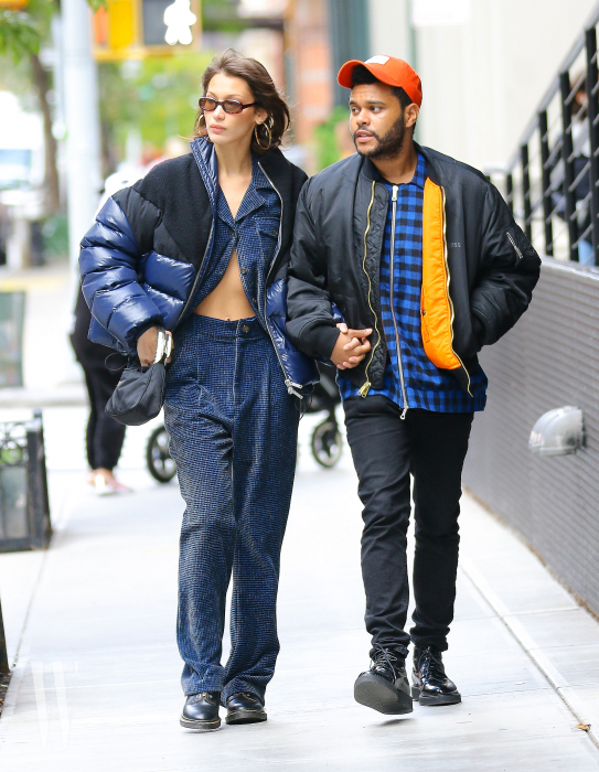 Bella Hadid and The Weeknd were spotted taking a romantic stroll around Tribeca Neighborhood.